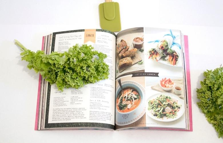 a recipe book with green leaves on it