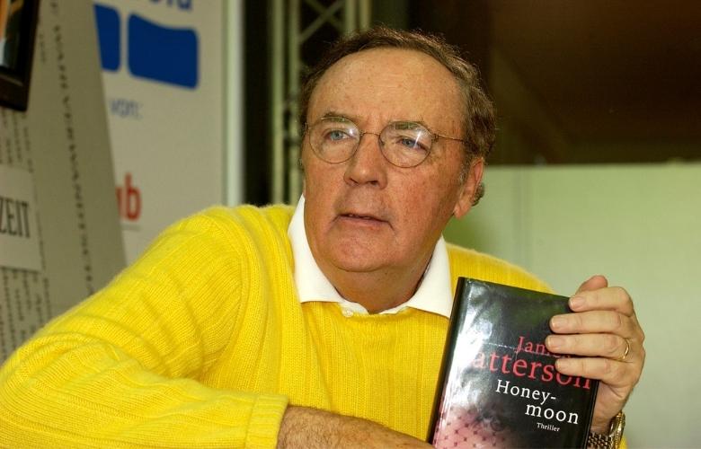james patterson holding a honeymoon book