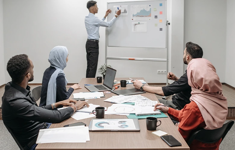 a group of people is actively listening to the speaker while doing a presentation.
